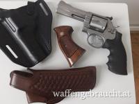 Smith & Wesson 686 - 3, 4 Zoll Lauf, Kal. .357 Magnum, neuer Hogue Griff + original Holzgriff + Sickinger Holster